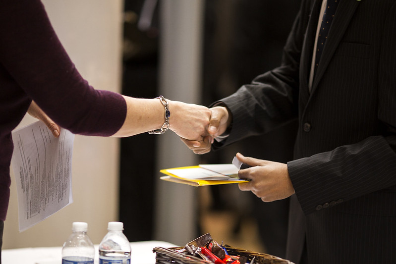 employer and student shaking hands